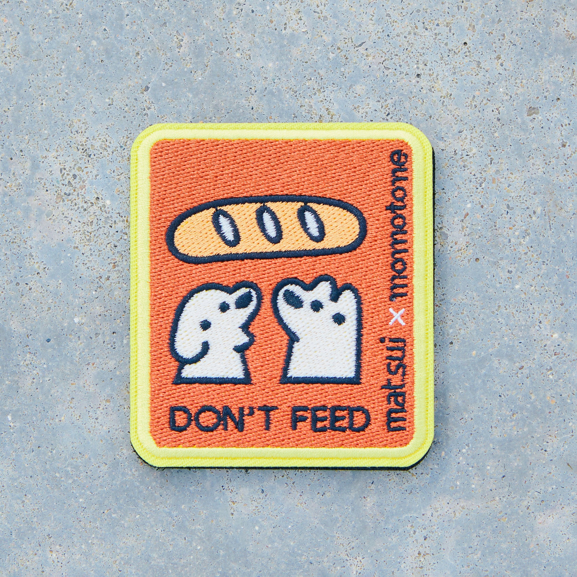 matsui x momotone / don't feed caution badge