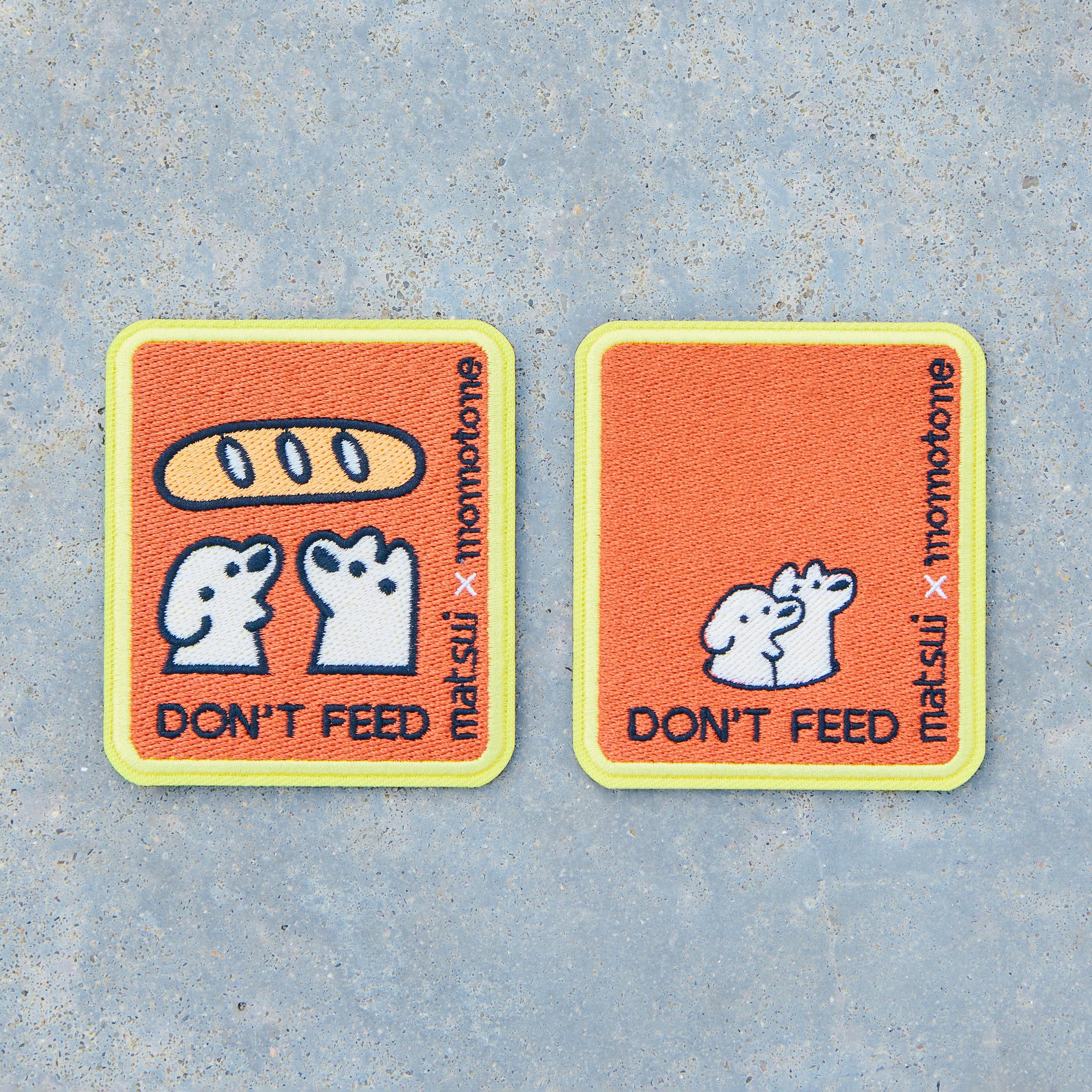 matsui x momotone / don't feed caution badge