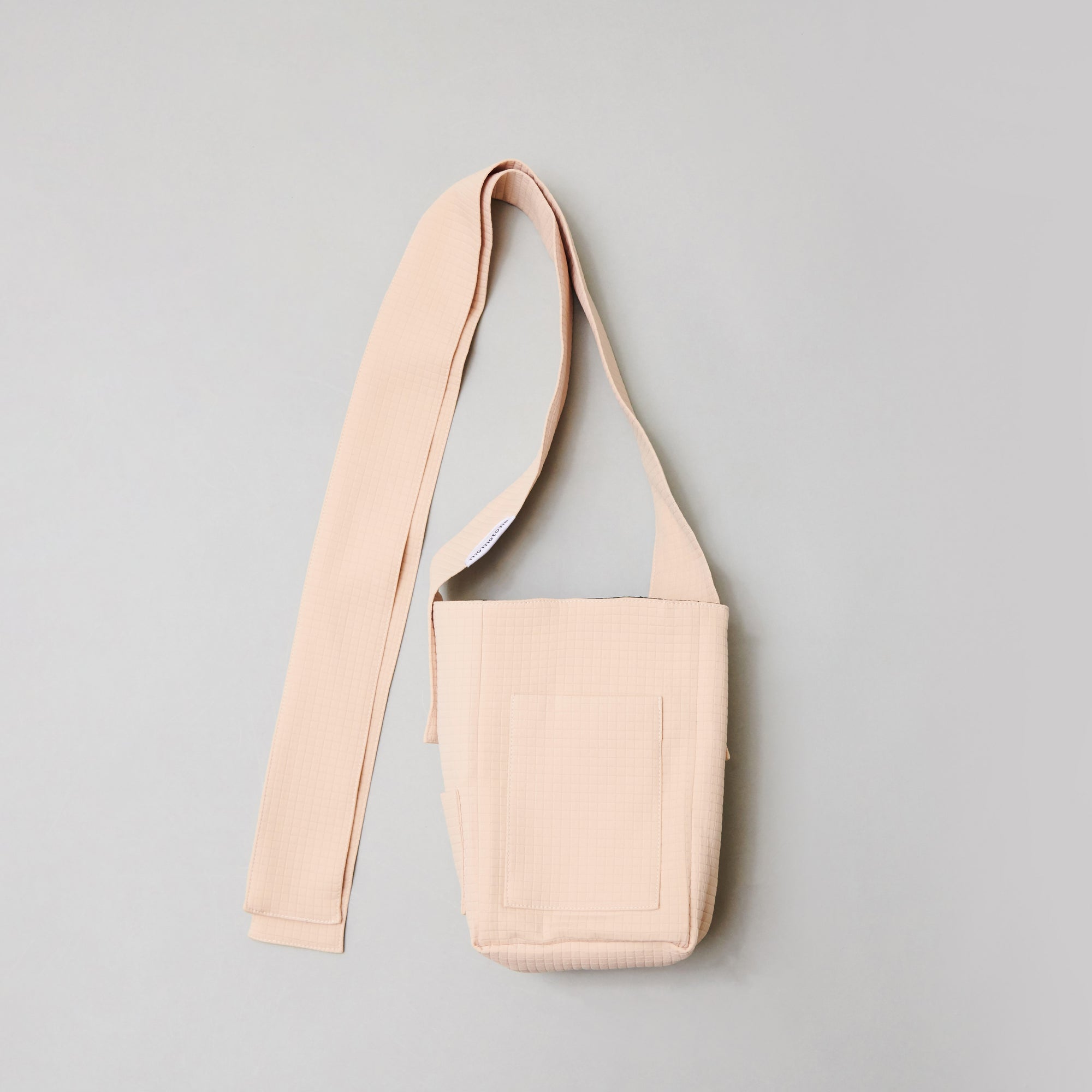 seed / hooman the handler light beige