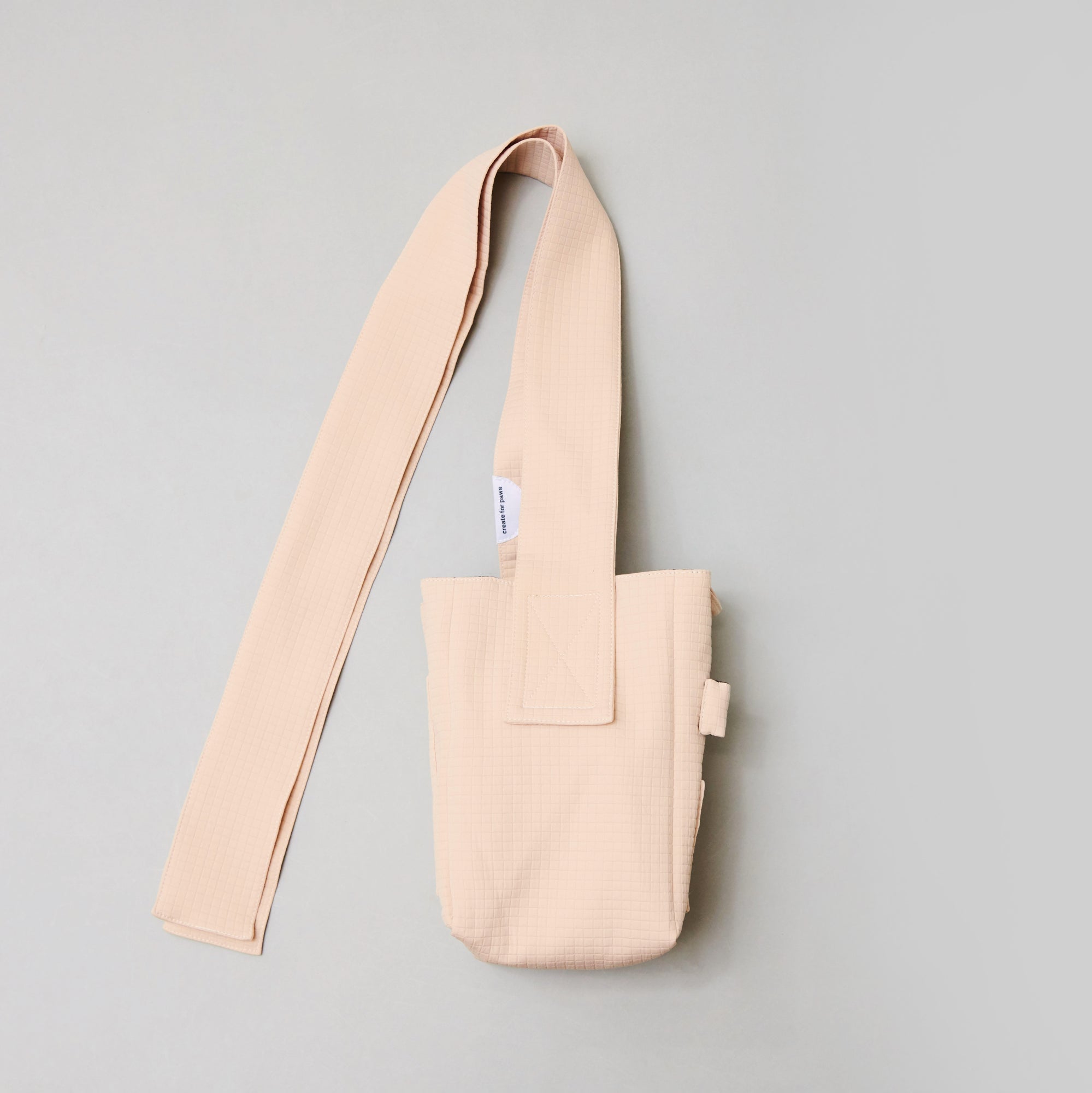 seed / hooman the handler light beige